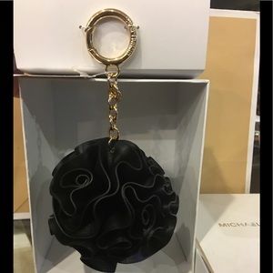 Michael Kors Black Leather Flower Ruffle Pom Pom